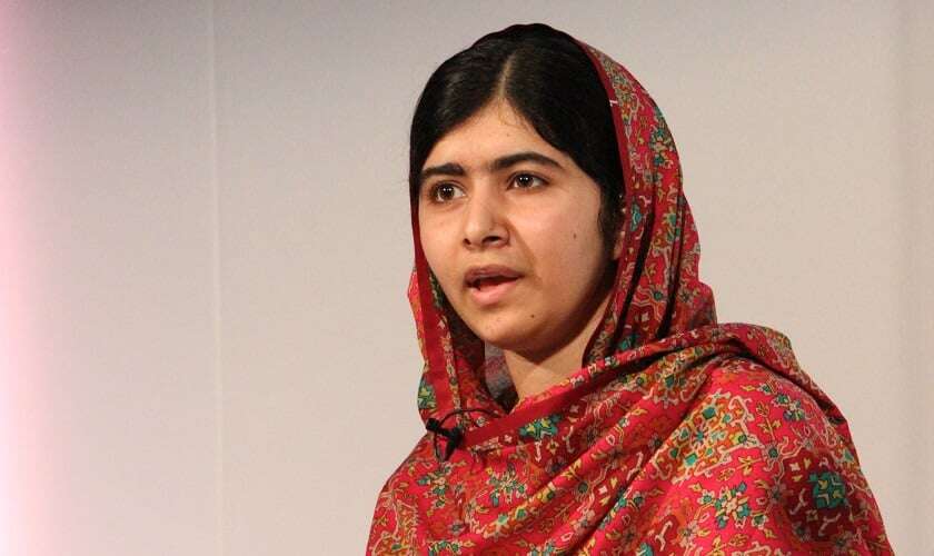 Image shows Malala Yousafzai against a plain background.