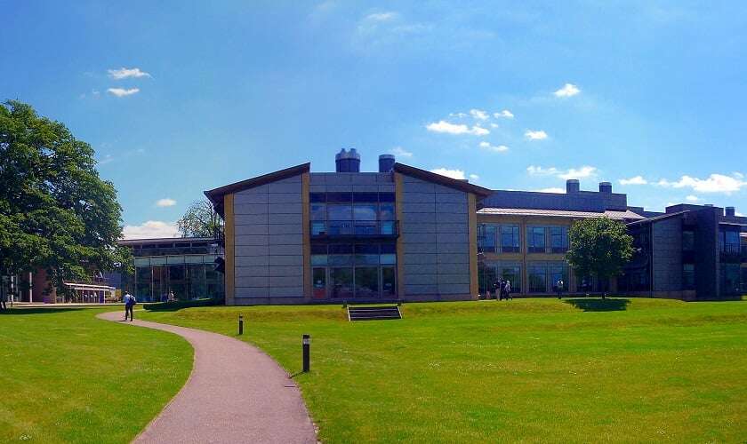 Image shows the Sanger Institute on a sunny day.