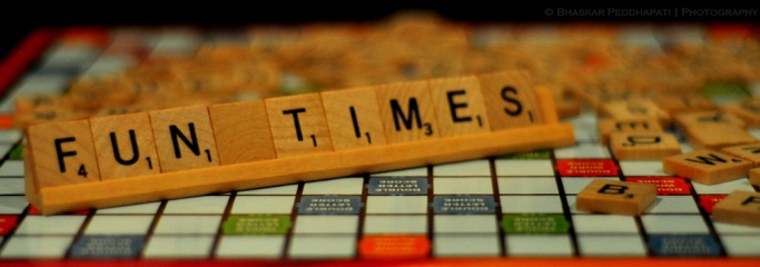 Image shows a scrabble board with tiles spelling out 