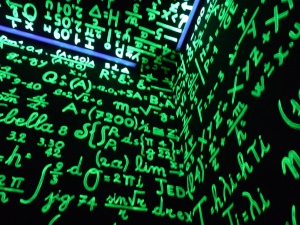 Image shows a black background covered with green mathematical formulae.