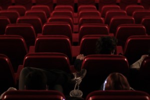 Image shows the seating in a darkened cinema.