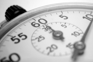 Image shows a stopwatch in black and white.