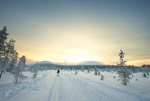 Image shows dawn over snowfall in Finland.