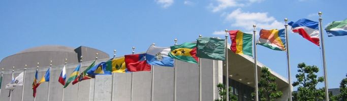 Image shows a row of flags from different countries.