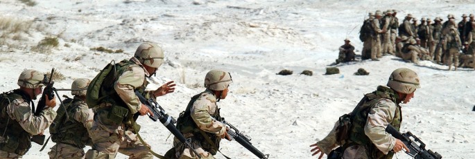 Image shows soldiers in the desert.