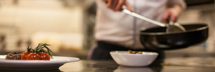 Image shows a chef in a kitchen.