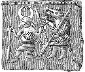 Image shows a man in a horned helmet with a man wearing a bear's head beside him. 