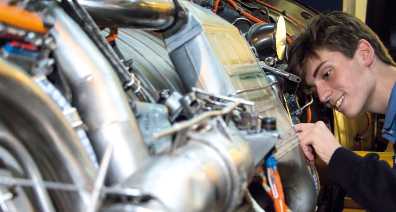 Student inspecting an engine at the Engineering Summer School hosted by Oxford Royale 2024/2025