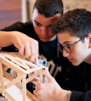 Students building a model bridge on our Oxford Engineering Summer School