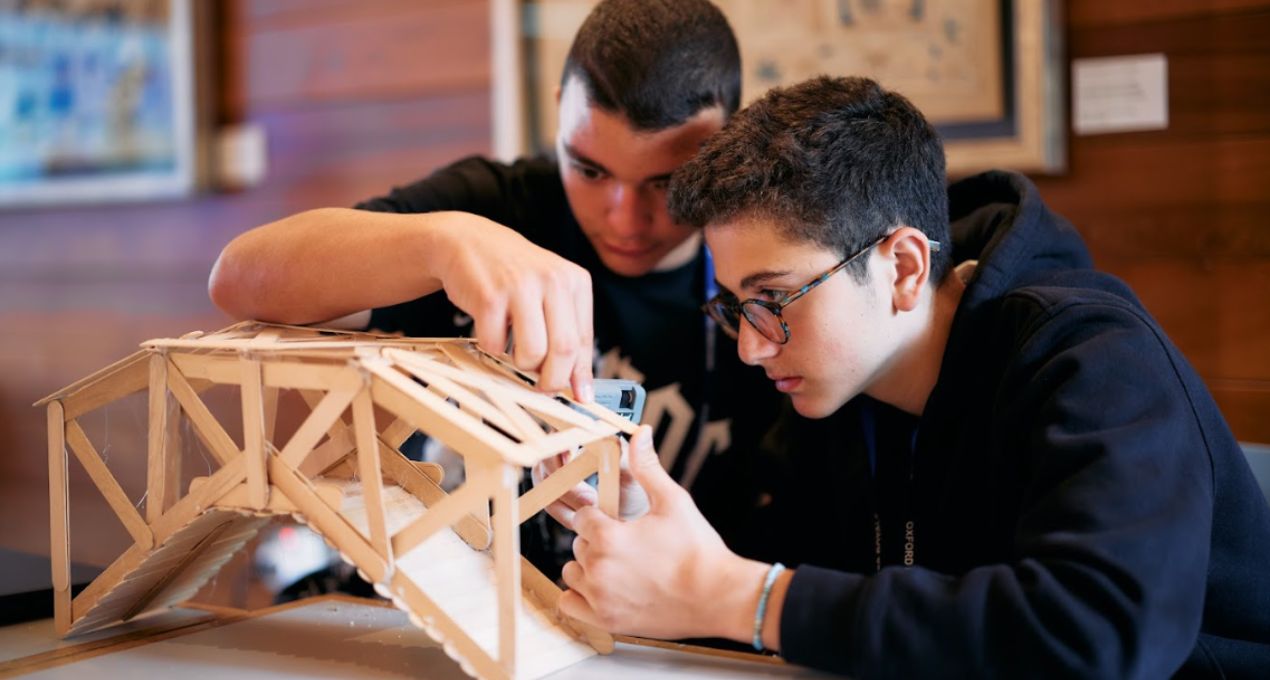 Students building a model bridge on our Oxford Engineering Summer School